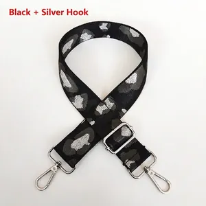 Adjustable black strap with silver hooks and grey leopard pattern for shoulder bags