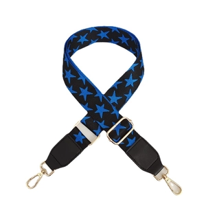Adjustable black strap with blue star pattern and gold metal hooks for handbags