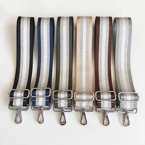 Macro shot of colorful striped backpack straps with durable silver metal swivel hooks