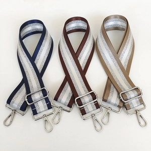 Adjustable woven striped bag straps with silver metal lobster clasps and buckles