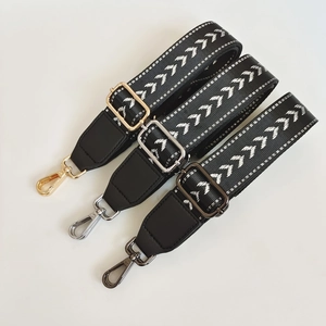 Adjustable wide replacement bag strap with white geometric arrow pattern and multi-color hardware