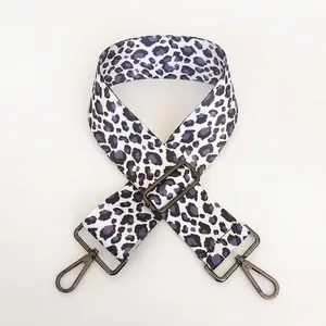 Close-up of leopard print purple bag strap with gunmetal swivel hooks and adjustable buckle