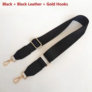 Close-up of adjustable black nylon bag strap with leather ends and gold metal hooks