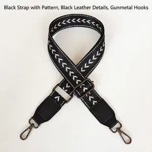 Adjustable black nylon shoulder strap with white chevron pattern and gunmetal hooks