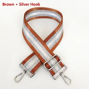 Detail of adjustable brown striped strap with durable silver metal swivel hooks