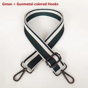 Detail of green and beige striped wide woven strap with gunmetal swivel hooks