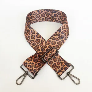 Detail of 5cm wide leopard print bag strap with adjustable gunmetal buckle and clasp