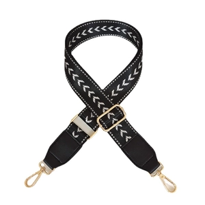 Adjustable wide replacement shoulder strap with black and white arrow pattern and gold buckles