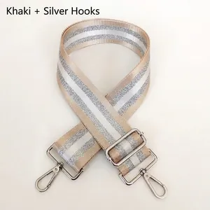 Detail of khaki stripe strap with adjustable metal buckle and silver swivel hooks