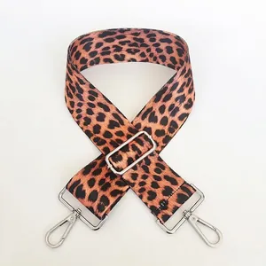 Detail of leopard print wide strap with adjustable silver buckle and lobster clasp hook