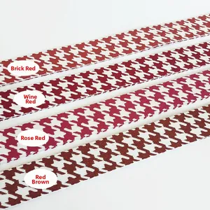Detail of four colorful houndstooth patterned replacement shoulder straps for handbags