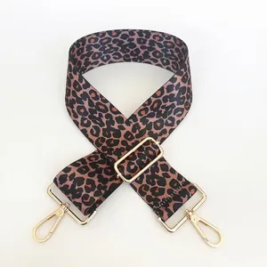 Detail of colorful leopard print bag strap with golden zinc alloy swivel hooks