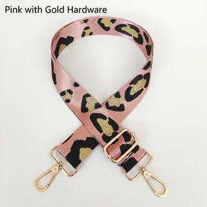 Adjustable leopard print bag strap with pink and gold accents and metal hooks
