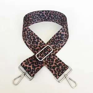 Detail of leopard print bag strap with silver metal buckle and adjustable slider hardware