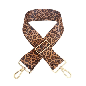 Adjustable leopard print bag strap with golden metal buckles and dense canvas texture