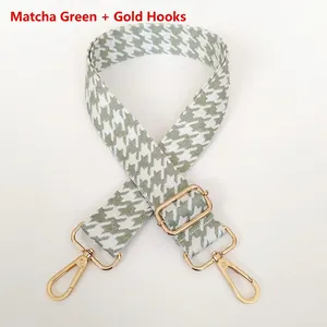 Close-up of matcha green houndstooth jacquard bag strap with gold metal hardware