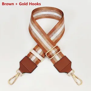 Detail of 5cm nylon shoulder strap with brown and white weave and gold metal swivel hook