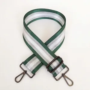 Detail of green and white striped bag strap with gunmetal swivel hooks and slider
