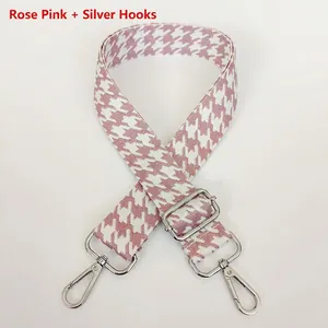 Detail of rose pink houndstooth jacquard strap with polished silver metal hook