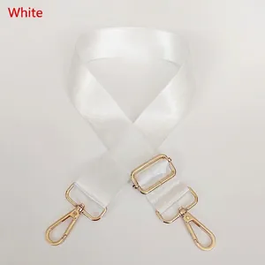 Detail view of adjustable white nylon strap with polished gold-tone metal lobster clasps