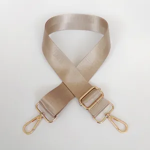 Adjustable khaki nylon bag strap with gold metal hooks for cross-body shoulder bags