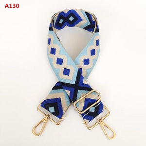 Detail of adjustable blue geometric diamond jacquard canvas strap with gold hooks