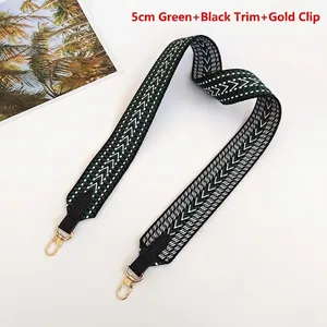 5cm wide green and black geometric woven canvas strap with gold metal hooks and leather