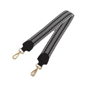 Stylish black and white geometric canvas bag strap with golden hardware and leather ends