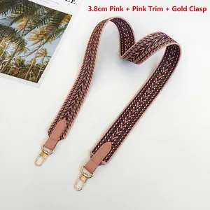Detailed close-up of 3.8cm wide pink woven shoulder strap with gold alloy hooks