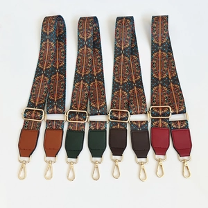Set of four bohemian embroidered bag straps with colorful patterns and golden hardware