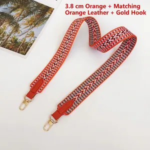 3.8cm wide orange woven herringbone canvas bag strap with leather ends and gold hooks