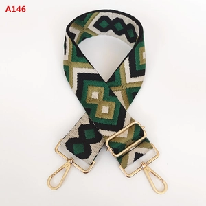 Detail of adjustable geometric diamond jacquard strap with gold-tone metal hooks