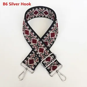 Detailed close-up of a bohemian geometric jacquard bag strap with silver metal hooks