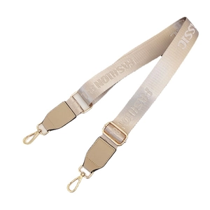 Adjustable beige nylon bag strap with Fashion Classic lettering and gold metal buckles