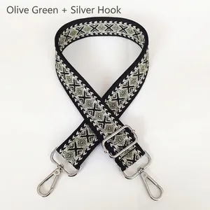 Detail of adjustable thick canvas strap with olive green diamond jacquard weave and silver hooks