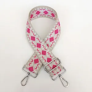 Macro view of thickened canvas strap with beige and rose red geometric diamond pattern