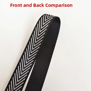 Detailed comparison of the front herringbone pattern and back plain side of the crossbody strap