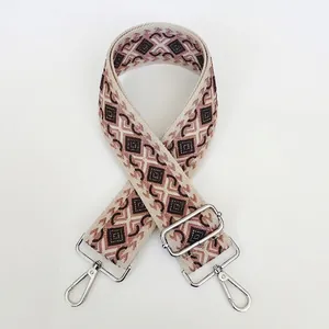 Detail of bohemian geometric rhombus pattern jacquard canvas strap with silver metal buckle