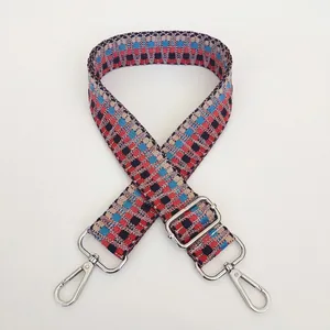Detail of adjustable woven jacquard bag strap B35 with silver metal carabiner hooks
