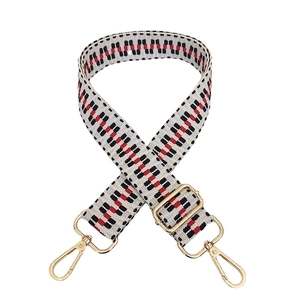 Adjustable wide replacement strap with red and black geometric wave patterns and gold buckles