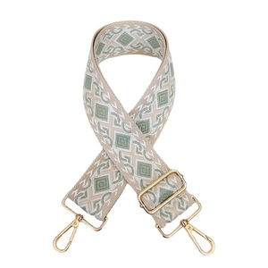 Adjustable wide canvas bag strap with green geometric jacquard and gold metal hooks