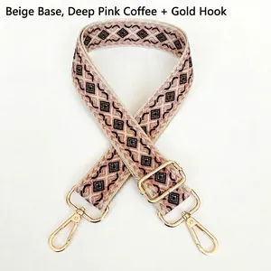 Close-up of geometric diamond pattern strap with golden metal lobster clasps and buckle