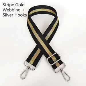 Adjustable black and gold striped woven bag strap with silver metal hooks for handbags