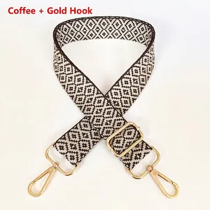 Adjustable brown and white diamond pattern canvas bag strap with gold metal hooks