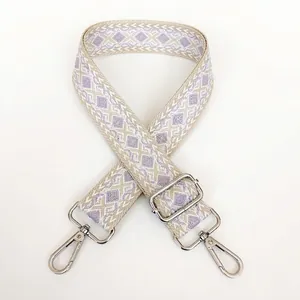 Detail of adjustable thickened canvas bag strap with beige and purple diamond jacquard
