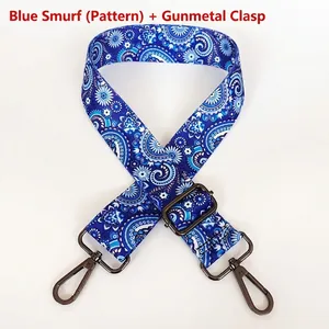 Close-up of adjustable blue paisley strap with gunmetal swivel hooks and floral patterns