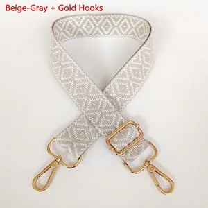 Adjustable wide canvas shoulder strap with beige geometric diamond jacquard and gold hooks