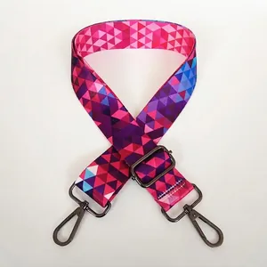 Close-up of adjustable wide strap with colorful geometric triangles and metal hooks