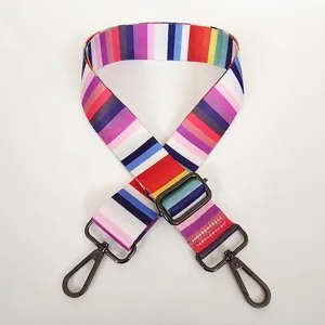 Detail view of colorful striped nylon replacement shoulder strap with gunmetal lobster clasps