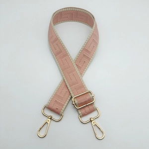 Pink and beige geometric patterned wide adjustable canvas shoulder strap with gold hooks